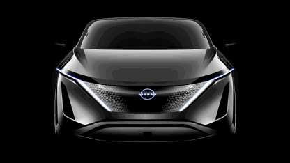 Black Nissan Aryia in dark environment 
